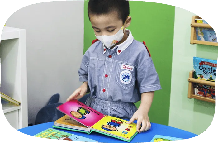 Student reading a picture book